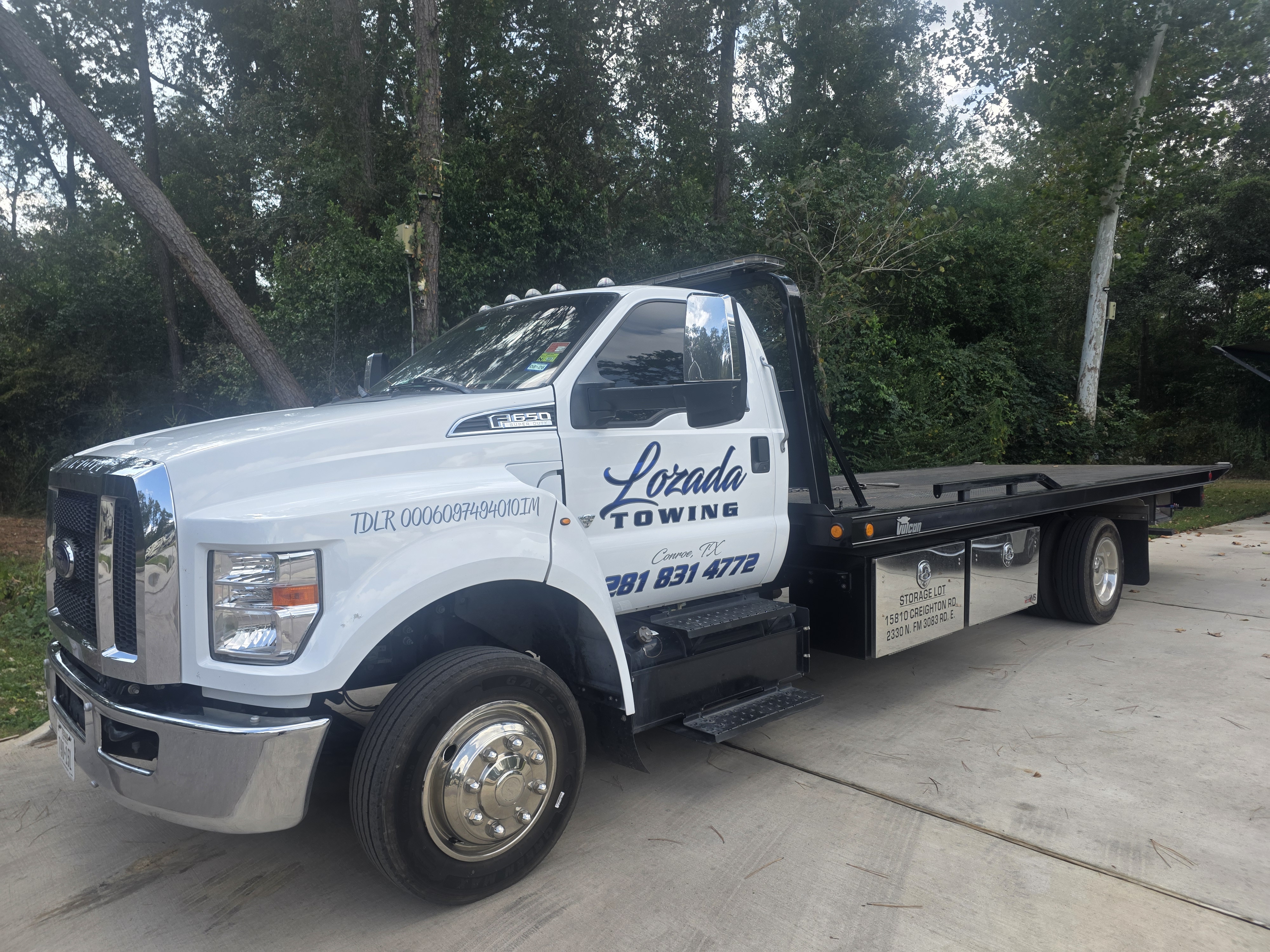 Lozada Towing flatbed rig parked